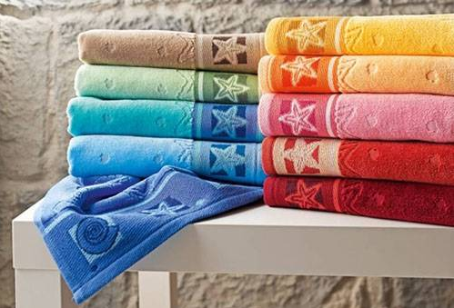 Різнокольорові махрові рушники